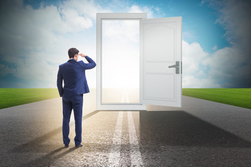 Businessman in front of door in business opportunities concept