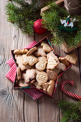  Christmas cookies in box as a star on a wooden background