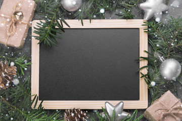 Black board with Christmas handmade presents with ribbon 