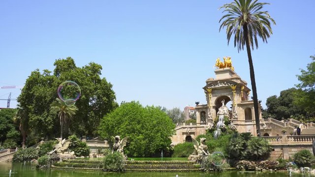 Soap colorful bubbles flying in Park de la Ciutadella of Barcelona, Spain