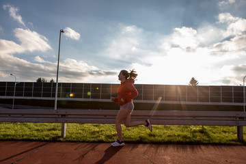 Fototapeta na wymiar running young woman 