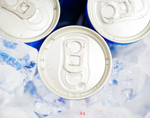 Soda cans in ice with condensation - drink can
