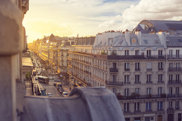 A picture of the beautiful architecture of Paris and the evening sun reflecting genlty on  the...