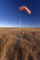 orange windsock on abandoned airstrip on Kansas prairie