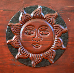 Wooden carving of sun interior decoration