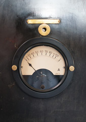 Close-up view of vintage old ammeter gauge.