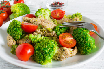 salad with chicken fillet, tomatoes cherry and broccoli
