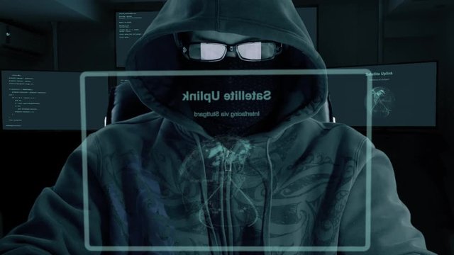 Hacker typing code. Night and low key. Close-up. Indoors night work. Programmer coding software of site. A hacker is preparing an attack on hacking portal.