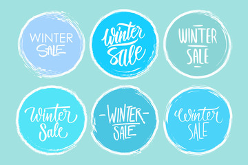 Fototapeta na wymiar Winter Sale hand drawn lettering set of special offer signs with handwritten text design and circle brush stroke backgrounds for business, promotion and advertising. Vector illustration.