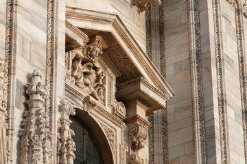View of architectural details on the massive gothic cathedral Duomo, Milan, Italy
