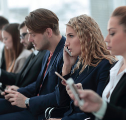 closeup of colleagues sitting at a business conference.