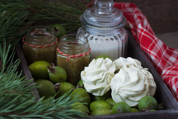 Winter feijoa tasted zephyr or marsmallows in the vintage wooden box with jam and sugar