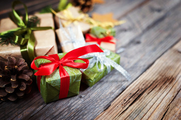 Christmas background with gift on wooden background with Fir branches. Xmas and Happy New Year composition.