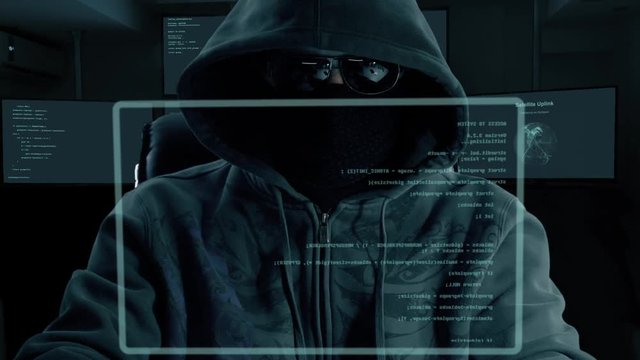 Male hacker typing program code. Dark night man at virtual screen coding. Programmer coding software of site. A hacker is preparing an attack on hacking portal.