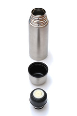 Metal thermos and cup isolated on white background