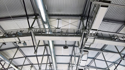 metal roof structures with a vent pipe and spotlights. aluminum profile details