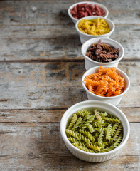 multicolored fusilia pasta (spiral) food background