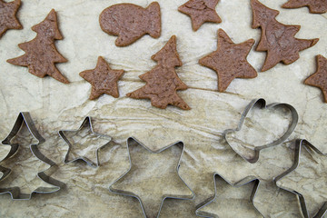 Cutting out Christmas cookies with cookie cutters