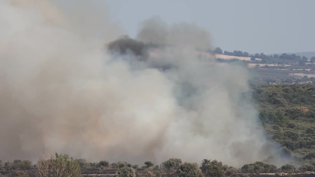 Helitack against huge fire smoke