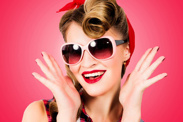 Fototapeta premium A young woman in the style of pin-up wear sunglasses