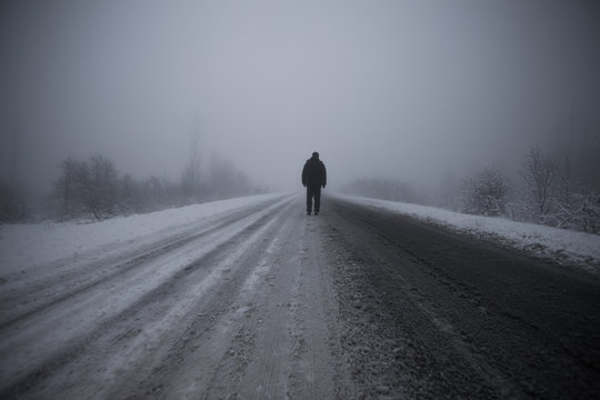 Man In The Fog On The Road