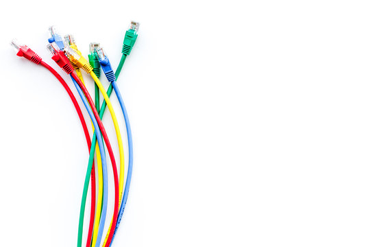 Colored patch-cord on white background top view copyspace