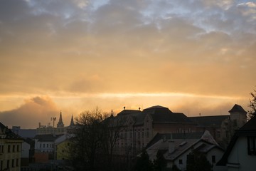 Sunrise and sunset over the buildings in the Zilina city. Slovakia