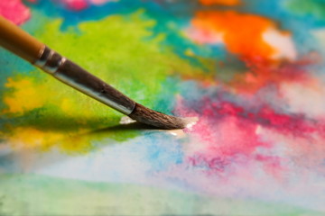 drawing with watercolor, brush with paint,