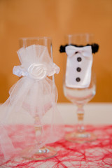 Decorated glasses of the bride and groom