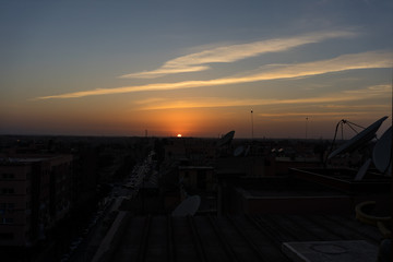 sunset in marrakesh morocco viewed from rooftop