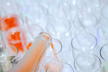 pink champagne poured into glasses
