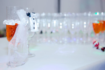 Decorated glasses of the bride and groom