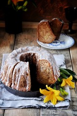 Apple cake with raisins in sugar glaze