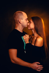 Girl and boy on the background of a sunset color