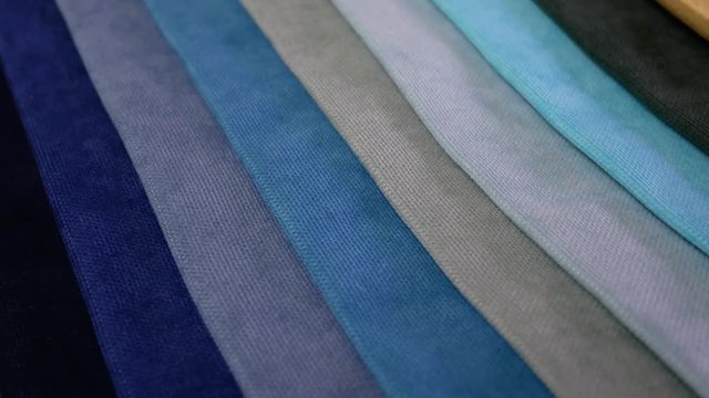 Collection of textile samples are spinning or rotation. Multicolor fabric texture background