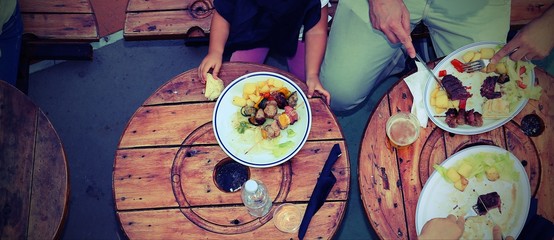 people photographed from above while eating  with vintage photo