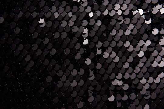 Background texture, pattern. Black and white Cloth paillettes. Look at these Neon black and white Paillette Sequins. Ideal for events, celebrations and christmas