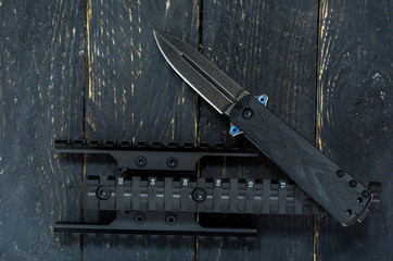 Knife and picatiny rail. Military composition.
