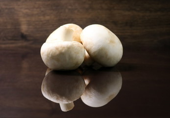 Fototapeta na wymiar Mushrooms. White mushrooms. Champignon. Fresh white delicious and healthy mushrooms.