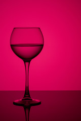 a glass of water on a gradient background