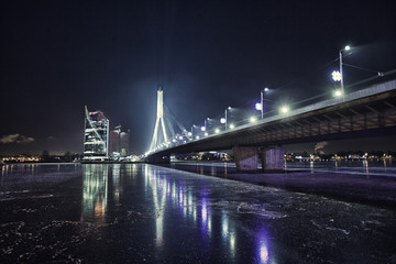 Fototapeta na wymiar Riga city bridge drone shooting above daugava river night