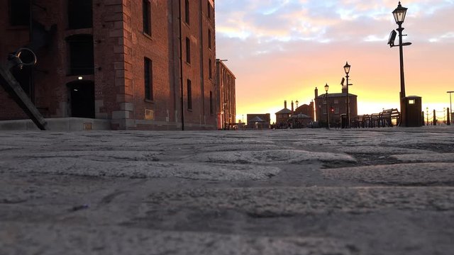 4k Albert docks in Liverpool, sun set, cobblestones and victorian buildings