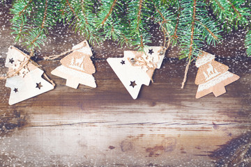 Christmas decorations on oldboards. Christmas background. New Year background. Xmax background. Christmas tree. Snow falls.