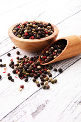 Colorful Peppers Mix in wooden scoop and bowl.