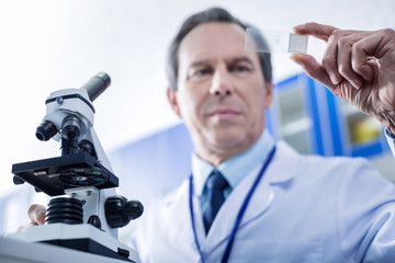 Modern biology studies. Selective focus of microscope equipment being used for biological research