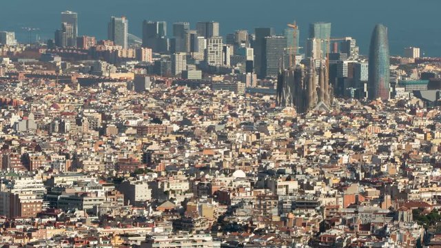Barcelona downtown to view.The Big city with the "Sagrada Familia", the technological district  22@ and the sea of background, and with the movement of shadows in buildings. Time Lapse.
