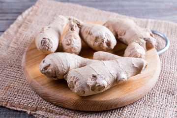 Healthy ginger root on cutting board
