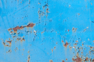 surface of rusty iron with remnants of old paint, chipped paint, blue texture, background