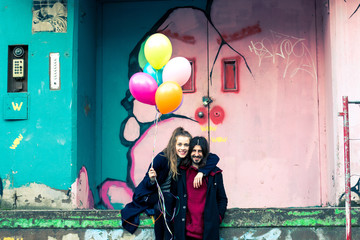 young couple with balloons