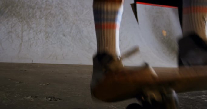 Man practicing skateboarding in skateboard arena 